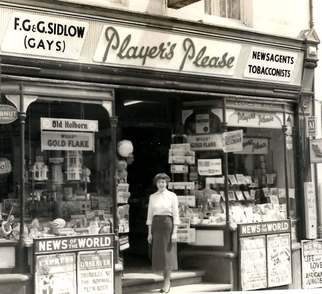 The author at her parents’ shop in 1958