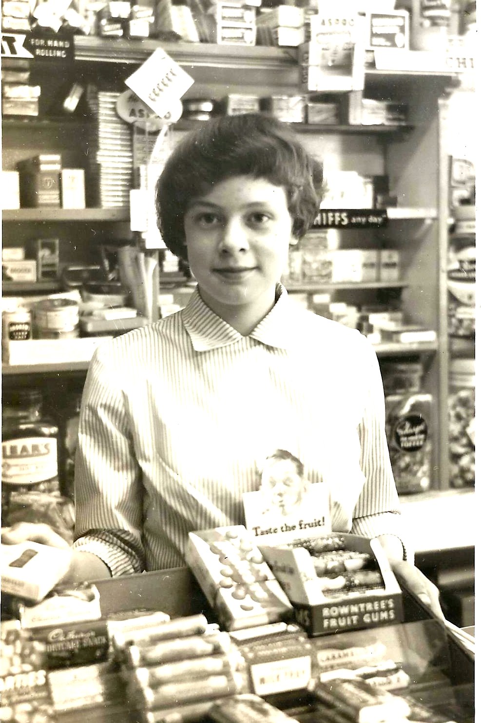 The author at her parents’ shop in 1958