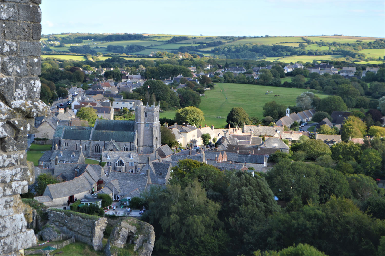 The village of Corfe Castle, Dorset taken from the ramparts of the ruined castle of the same name. Image Copyright N.Thorne 2020