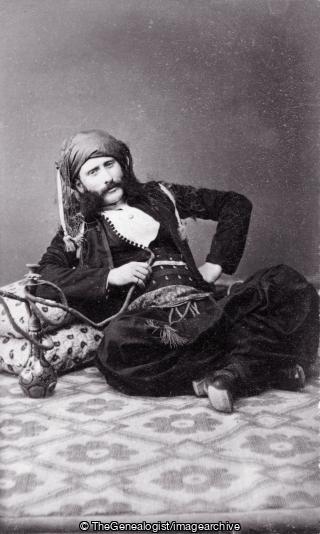 Actor dressed as Arab smoking Hookah (Actor, Arab, C1900
, Hookah, smoking, Turban)