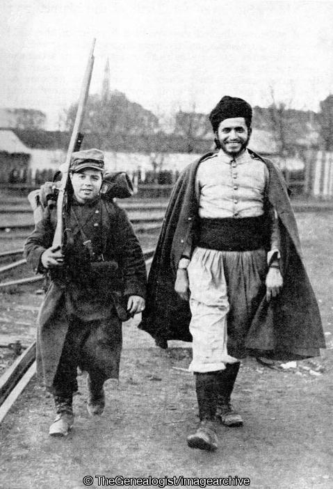'Baby Rose' such is the nickname bestowed on the smallest of French soldiers, who appears. He is a great favourite with the Zouaves, one of whom is seen accompanying him (Baby Rose, France, French soldiers, WWI, Zouaves)