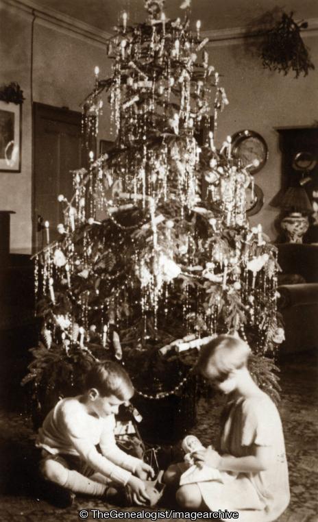 Christmas Tree with children opening presents (C1930, Children, Christmas, Christmas tree)