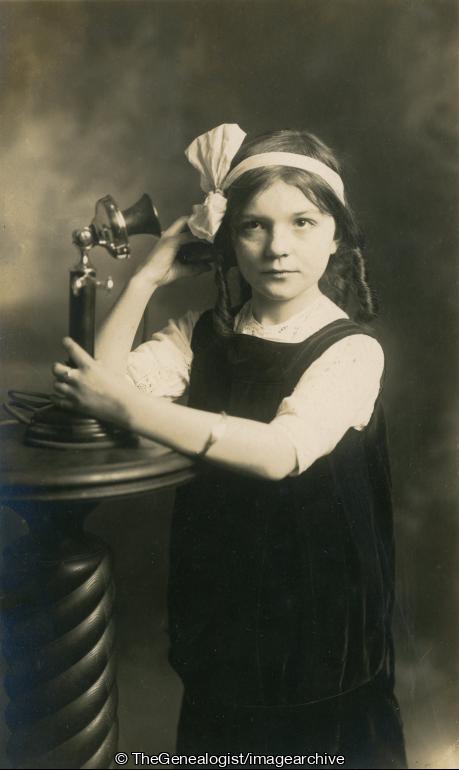 Girl on candlestick phone (C1915, candlestick telephone, Girl, Telephone)