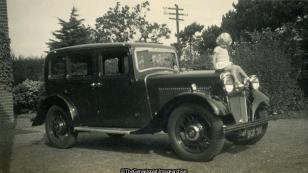 Girl Sitting on bonnet of car (Car, Morris 10)