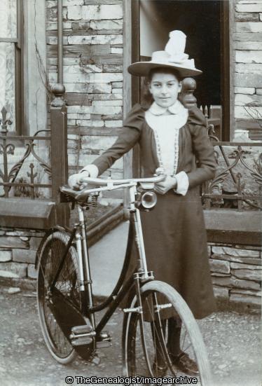 Girl with bike Keswick C1900 (bicycle, Girl, Keswick)