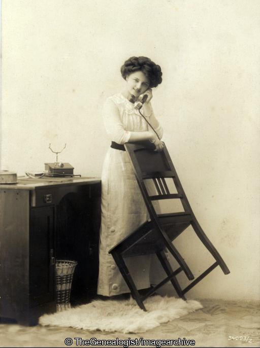 Lady leaning on chair with phone_og (C1930, chair, desk, Lady, leaning, office, phone, Telephone)
