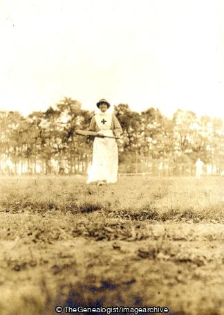 Nurse with cricket bat (France, Lady Iris Capell, Le Tréport, Nurse, Red Cross, WW1)