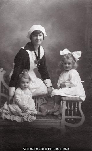 Nursery Nurse with two children on Rocking seat (Children, Nanny, Nursery Nurse)