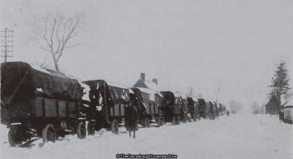 Oh! it was an unlovely war! The paraphrase of the old trench song is suggested by these scenes. A motor transport column at the roadside in winter snow (16th Battalion, Convoy, Highland Light Infantry, Lorry, Snow, WW1)