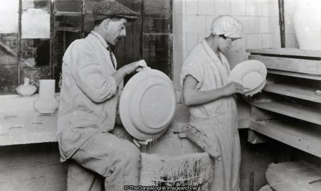 Poole Pottery Dipping the ware in the Glaze (C1935, Dorset, England, Glazing, Poole, Poole Pottery, Pottery, Process)