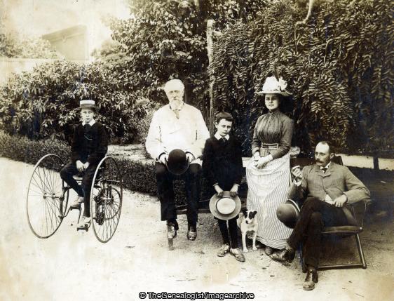 Three Wheel Bike and Captain Shaw in Gardens (boater, Derby hat, Dog, Garden, Tricycle)