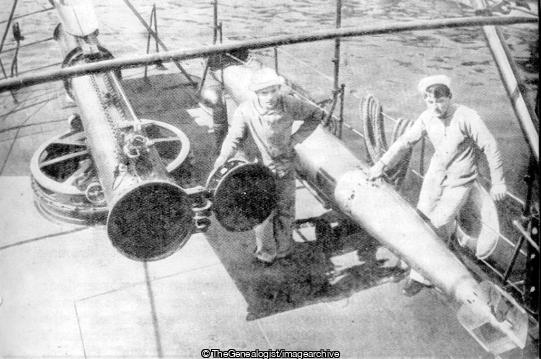 View of a torpedo and its tube on board a destroyer the tube you will observe can be trained like a gun and thus a correct aim can be taken (Destroyer, Navy, WWI)